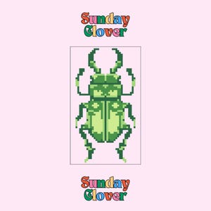 May include: A pixelated green beetle illustration with a light green body and darker green details. The image is set against a light pink background and includes the text "Sunday Clover" in a colourful, retro font above and below the beetle.