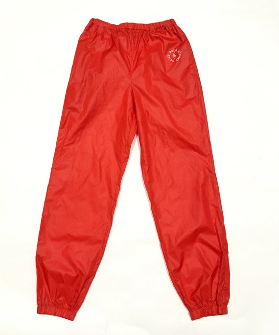 red nylon track pants