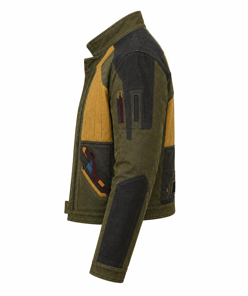 May include: A side view of an olive green jacket featuring mustard yellow panels on the chest and back, black shoulder and elbow patches, and decorative geometric accents in maroon and blue on the front pocket and sleeve areas.