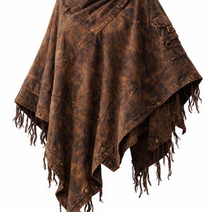 May include: A brown poncho with a mottled, distressed texture, featuring a high collar, metal snap buttons, and a small utility pocket on the shoulder. The garment has an asymmetrical hemline finished with long, dangling fringe trim throughout.