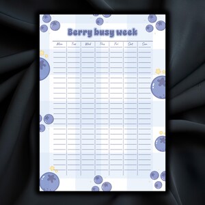May include: A weekly planner sheet with a light blue and white checkered background, featuring the text Berry busy week at the top. The grid includes columns for each day of the week from Monday to Sunday, decorated with illustrations of blueberries.
