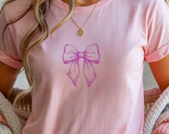 Camiseta rosa sencilla con lazo vintage coqueto, cinta gráfica, camiseta minimalista femenina para balletcore, estilo suave, atuendo moderno, regalo