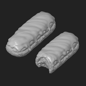 May include: Two grey eclairs, one with a bite taken out, against a dark background. The eclairs have a cylindrical shape with a wavy, glazed topping. The bite reveals the interior texture of the pastry.