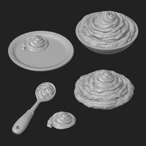Peut inclure: Un ensemble de monticules gris clair, texturés et en spirale, ressemblant à de la crème fouettée ou du glaçage. Le lot comprend une petite noisette sur une assiette perlée, une portion dans un bol, une cuillerée et deux monticules isolés.