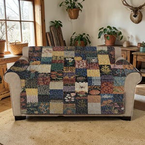 May include: A white ceramic mug with a black handle and the text "But First, Coffee" in a black, handwritten-style font. The mug is on a white surface.