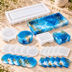 May include: A collection of silicone molds and finished resin coasters and trays. The set includes rectangular and circular molds, along with blue and white marbled resin pieces decorated with gold flakes in various shapes and sizes.