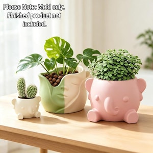 May include: Three silicone molds for planters. One small white elephant-shaped mold, one medium two-toned green and beige face-shaped mold, and one large pink elephant-shaped mold. Text reads: Please Note: Mold only. Finished product not included.