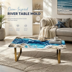 May include: A rectangular river table featuring a central blue and white resin pour mimicking ocean waves, surrounded by light-colored wood edges. The table is supported by two gold-toned metal legs and displays a white coral piece on its surface.