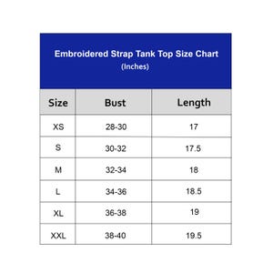 May include: A size chart for an embroidered strap tank top with a dark blue header. The table lists sizes from XS to XXL, with bust measurements ranging from 28 to 40 inches and length measurements from 17 to 19.5 inches, all displayed in inches.