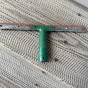 Green metal squeegee, Arrow brand, antique