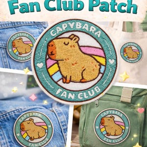May include: Embroidered "Capybara Fan Club" patches. The patches feature a cartoon capybara with a colorful rainbow design. The patches are shown on denim, a tote bag, and a green backpack. Text on the image reads "Perfect for jackets, bags & more!"