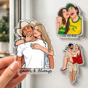 May include: Three custom acrylic magnets featuring illustrated couples. One shows a person in a cowboy hat with the text 'Forever & Always'. Another depicts a couple in Brazil shirts with 'I LOVE YOU MORE'. The third shows a couple with 'S H'.