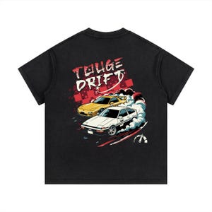 May include: A white ceramic mug with a black handle and the text "But First, Coffee" in a black, bold font. The mug is sitting on a white surface.