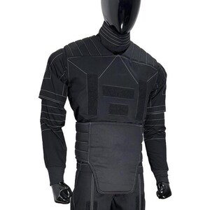May include: A black tactical-style long-sleeve shirt and pants set featuring a high collar, padded chest and waist panels, and white contrast stitching. The garment includes rectangular hook-and-loop fastener patches on the chest and legs.
