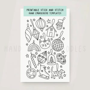 May include: A white sheet featuring black line drawings of Christmas-themed elements, including baubles, a house, a cat, a rainbow, and a dog. The text "PRINTABLE STICK AND STITCH HAND EMBROIDERY TEMPLATES" is displayed at the top of the sheet.