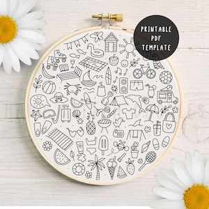 May include: An embroidery hoop featuring a hand-drawn summer design. The design includes a beach scene, sun, ice cream, and a bicycle. The text "Printable PDF Template" is in a black circle. The hoop is made of wood.