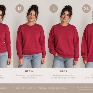 Puede incluir: Una sudadera de cuello redondo en color rosa oscuro s&oacute;lido mostrada en cuatro tallas, de la S a la XL. Las etiquetas indican las variaciones de talla, con descripciones en alem&aacute;n que explican el ajuste, de entallado a holgado.