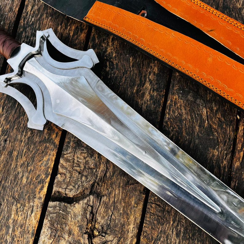 Detailed close view of the artistic guard design of the handmade fantasy knife, showing its unique shape and smooth finishing. The guard adds character and protection while enhancing the overall visual appeal. This piece stands out as a collector item and makes a great gift for husband or anyone interested in distinctive handmade designs.