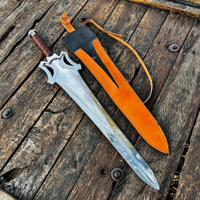 Leather wrapped handle detail of the handmade fantasy knife showing tight wrapping and comfortable grip design. The handle provides both aesthetic appeal and functionality, ensuring a secure hold. Ideal for collectors or as a gift for husband, this knife combines craftsmanship with a premium handmade look.