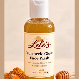 May include: A clear plastic bottle of Lele's Turmeric Glow Face Wash with a white flip-top cap. The label reads: Lele's Turmeric Glow Face Wash with Manuka Honey, Aloe & Licorice Root, 2.5 FL OZ / 74 mL. The liquid inside is a golden yellow color.