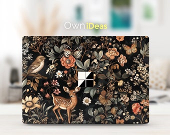 May include: Laptop skin with a dark background and a floral pattern featuring a deer, birds, butterflies, and flowers in shades of brown, orange, and white. The text "OwnIdeas" is visible at the top of the image.