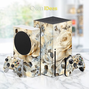 May include: Two beige and white floral patterned Xbox Series X console skins. The skin on the left is for the console and the skin on the right is for the controller. The design features a watercolor-style floral pattern with beige roses and leaves.