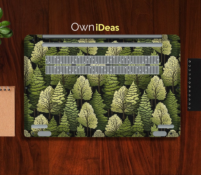 May include: A laptop skin with a forest pattern. The design features a repeating pattern of green and yellow trees on a black background. The skin is made of durable vinyl and is easy to apply and remove.