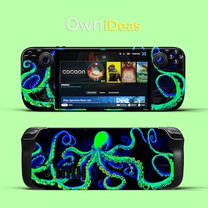 May include: A black and green gaming console with a blue and green octopus design. The console has a screen that displays the text "Play Aperture Desk Job".