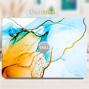 May include: A laptop skin with a blue, orange, and green abstract design with gold accents. The design features swirling lines and a subtle glitter effect. The Dell logo is visible on the skin.