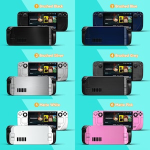 May include: A collection of handheld gaming consoles in various colors: brushed black, brushed blue, brushed silver, brushed grey, matte white, and matte pink. Each console features a screen displaying a game interface and a matching colored back.