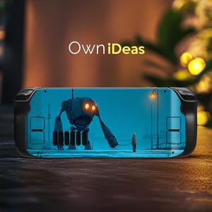 May include: A black handheld gaming console with a custom skin. The skin displays a surreal illustration of a robot and a person in a snowy scene. The text "OwniIdeas" is in white.