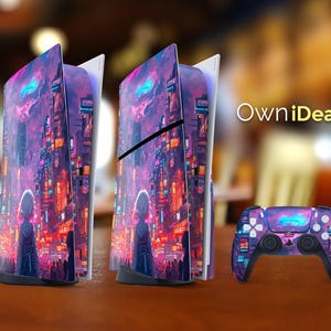 Puede incluir: Un conjunto de consola y mando de juegos con un diseño vibrante de paisaje urbano en tonos morados, rosas y naranjas. La consola tiene una piel a juego, y el mando tiene un diseño similar. El texto "OwniDeas" es visible.