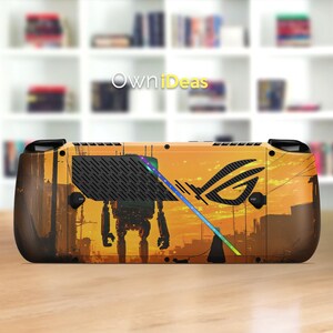 May include: A handheld gaming device with a custom skin featuring a sunset-themed cityscape and a robot illustration. The skin also includes the ROG logo and a colorful light strip. The device is set against a blurred background.