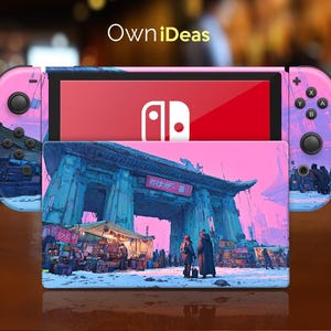 May include: A Nintendo Switch console with a custom design. The Joy-Con controllers and the back of the console are pink and purple with a cityscape design. The screen displays the Nintendo logo on a red background. The console is on a wooden surface.