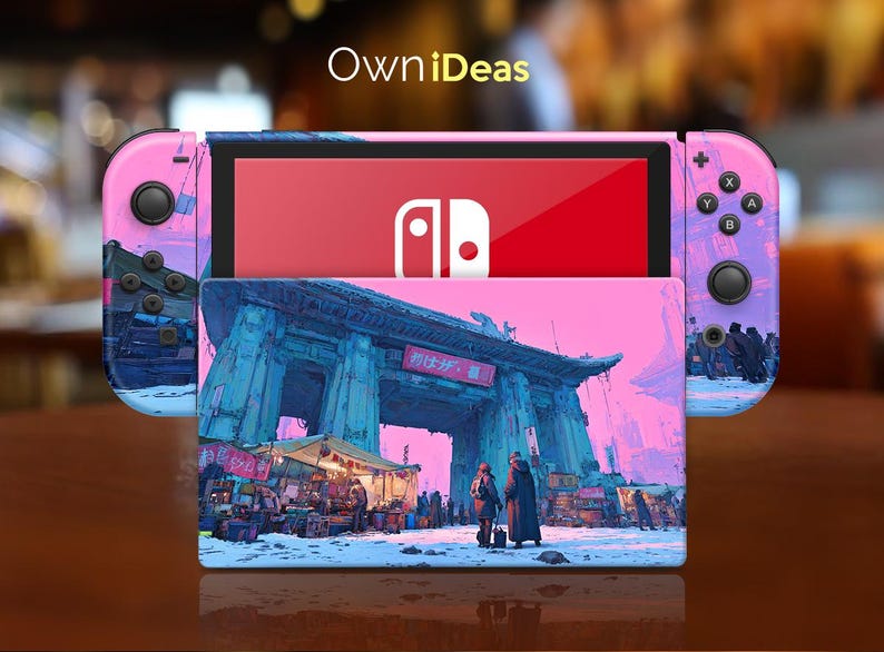 May include: A Nintendo Switch console with a custom design. The Joy-Con controllers and the back of the console are pink and purple with a cityscape design. The screen displays the Nintendo logo on a red background. The console is on a wooden surface.