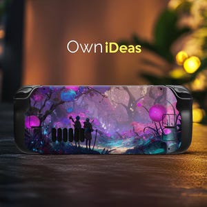 May include: A black handheld games console with a colourful skin depicting a fantasy forest scene in purple and blue. Two figures are silhouetted. The text "OwniIdeas" is displayed in white.