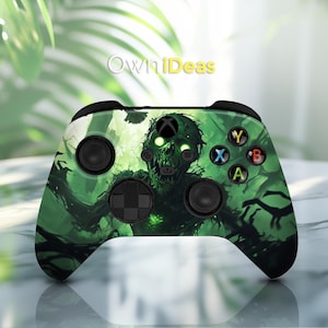 May include: A green, black, and white Xbox controller with a zombie graphic. The controller has a green and black zombie face with glowing green eyes.
