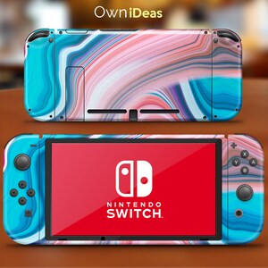 May include: A blue and pink Nintendo Switch console with a swirl pattern. The console is closed and the Nintendo Switch logo is visible on the screen.