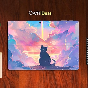 May include: A laptop skin with a colorful, abstract design featuring a black cat silhouette against a backdrop of pink, purple, and blue clouds. The design evokes a dreamy, whimsical atmosphere.