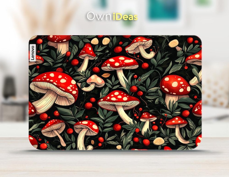 May include: A Lenovo laptop case featuring a vibrant pattern of red mushrooms with white spots, interspersed with green leaves and red berries, set against a black background. The case has the text "Own iDeas" and "Lenovo" on it.