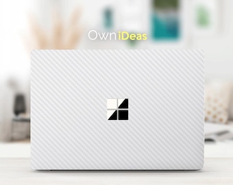 May include: White laptop skin with a carbon fiber pattern and the Windows logo in the center.