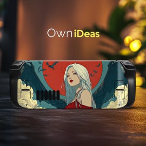 May include: A black handheld gaming device with a custom skin featuring a woman with long white hair, red lips, and a red dress. The design includes a red sun, bats, and the text "OwniIdeas".