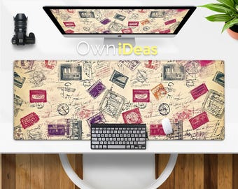 May include: A vintage-style desk mat with a pattern of colorful stamps and handwritten notes. The mat is beige with red, purple, and blue accents. The text "OwnIdeas" is visible in the background.