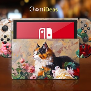 Puede incluir: Una piel de diseño floral y de gato de colores para una consola Nintendo Switch. La piel presenta un gato calico con ojos verdes, rodeado de flores rosas, rojas y blancas. La piel también incluye el logotipo de Nintendo Switch.