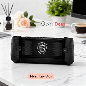 May include: A black handheld gaming device with the text "Msi claw 8 ai" at the bottom. The device features a silver emblem with a dragon design. The device has a textured surface and ventilation grilles.