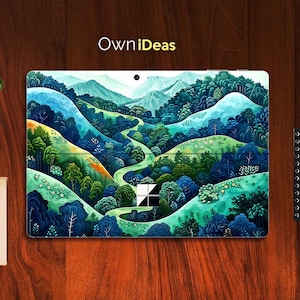 May include: A laptop skin with a colourful, abstract design featuring a winding path through a green and blue forest. The design is reminiscent of a landscape painting.