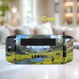 May include: A Lenovo Legion gaming device featuring a landscape design with dinosaurs, mountains, and a river. The device has a black vent and the word "LEGION" is visible. The background is a blurred living room.