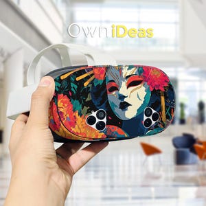 May include: VR headset with a colorful design featuring a stylized face with red, blue, and cream tones, surrounded by floral elements. The headset has a white strap and the text "OwniDeas".