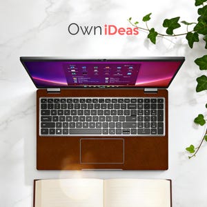 K&ouml;nnte beinhalten: Ein ge&ouml;ffnetes Laptop mit einer braunen, ledertexturierten Oberfl&auml;che, das eine farbenfrohe Benutzeroberfl&auml;che anzeigt. Die Tastatur ist sichtbar, und der Bildschirm zeigt verschiedene Anwendungssymbole. Der Text "OwniDeas" befindet sich oben. Ein offenes Buch befindet sich unten.
