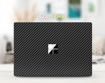May include: Black laptop skin with a carbon fiber pattern and the Microsoft Windows logo in the center. The skin is designed to protect and personalize your laptop.